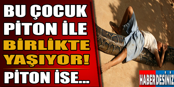 Bu çocuk piton ile birlikte yaşıyor!